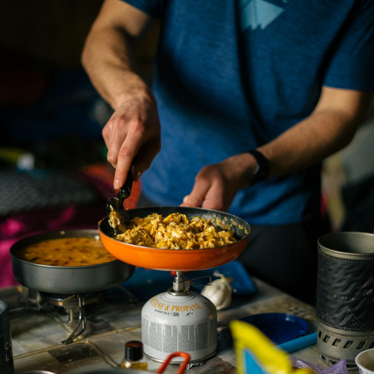 Community members working together in a modern kitchen, exchanging recipes and techniques